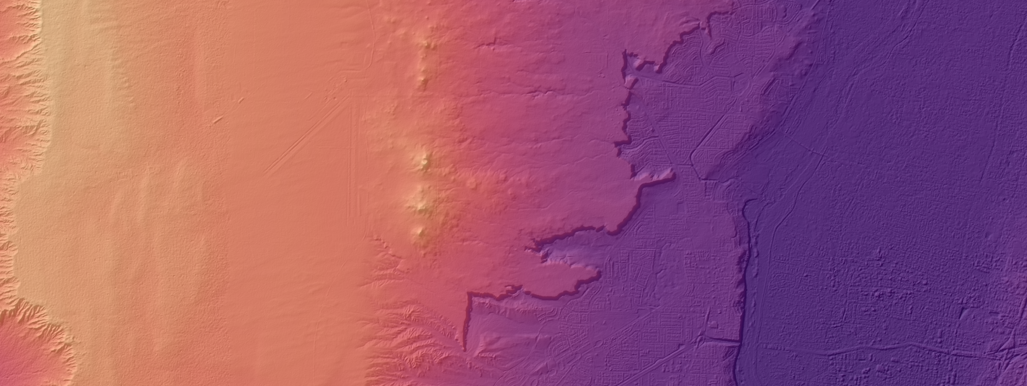 Shaded relief image of part of the Albuquerque, New Mexico, area colored with a purple-orange-yellow color ramp.